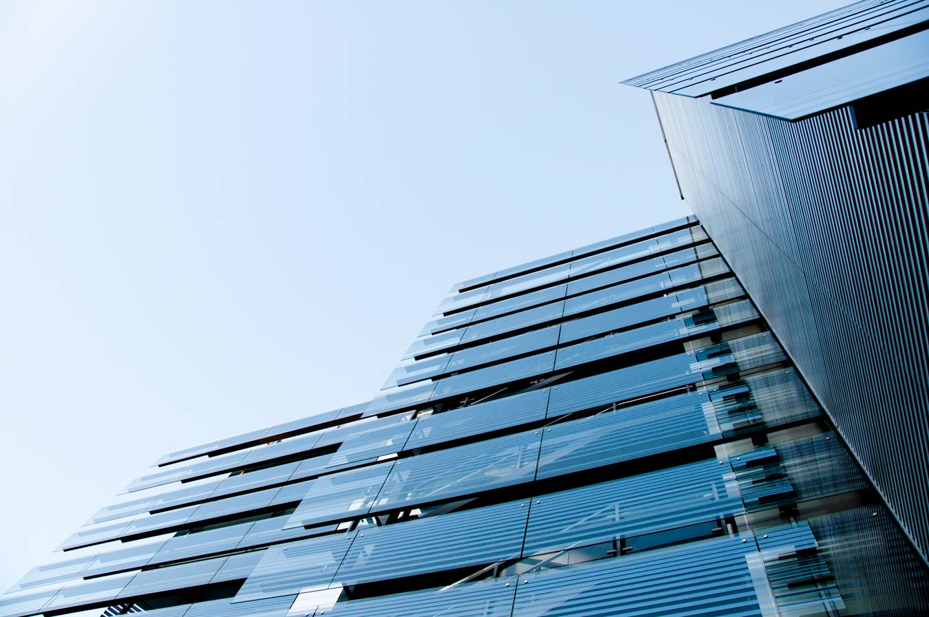 The glass facade of the Owen G Glenn Building