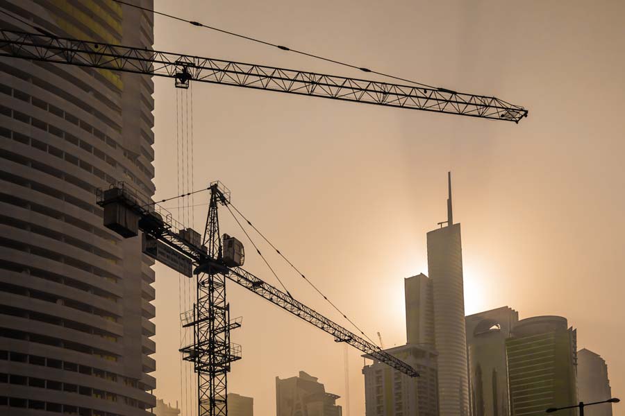 The morning sun takes a peek around the highrises on Sheikh Zayed Rd (E11 Highway)