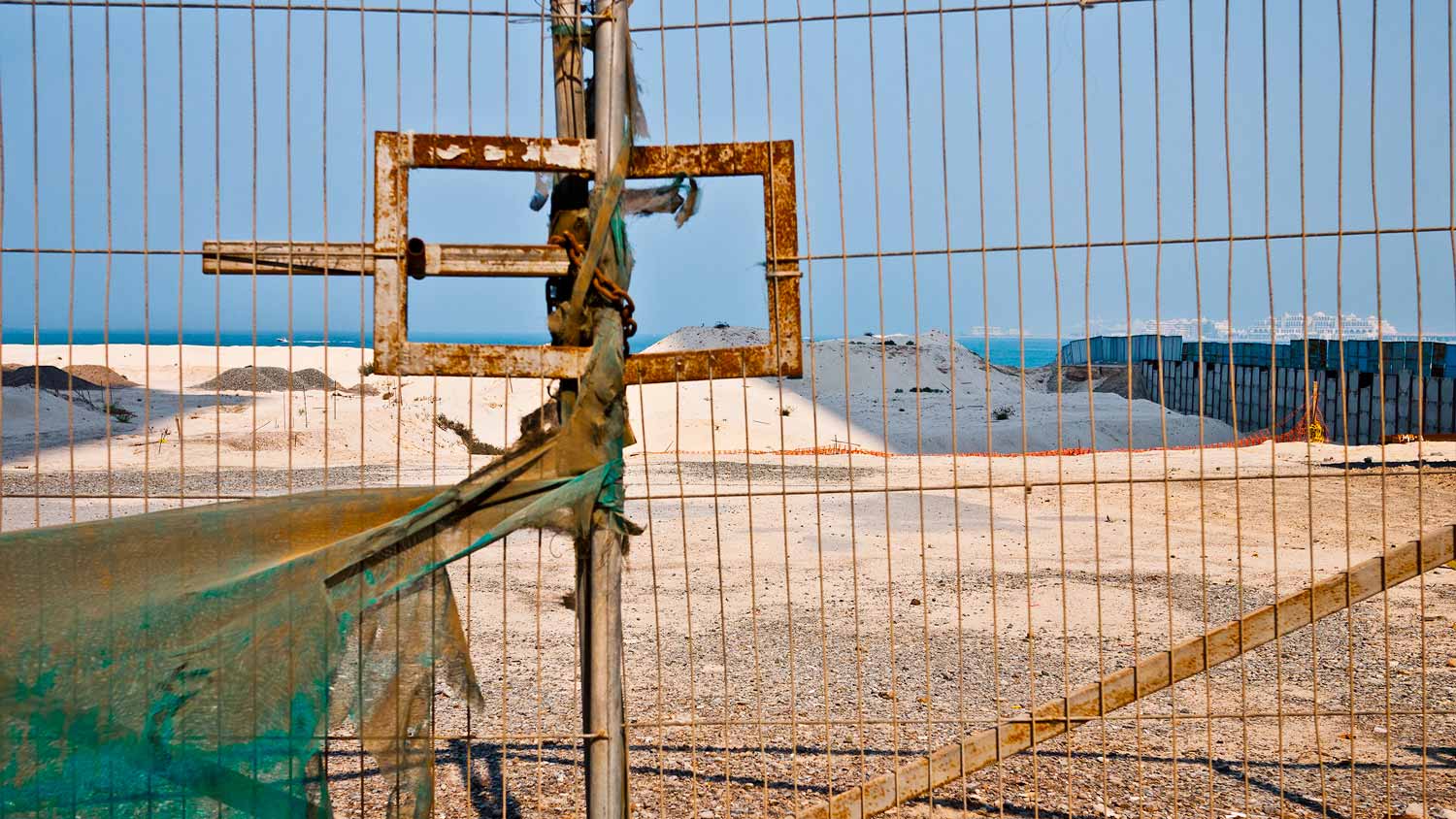 Sand is stockpiled and awaiting transformation to pristine beach