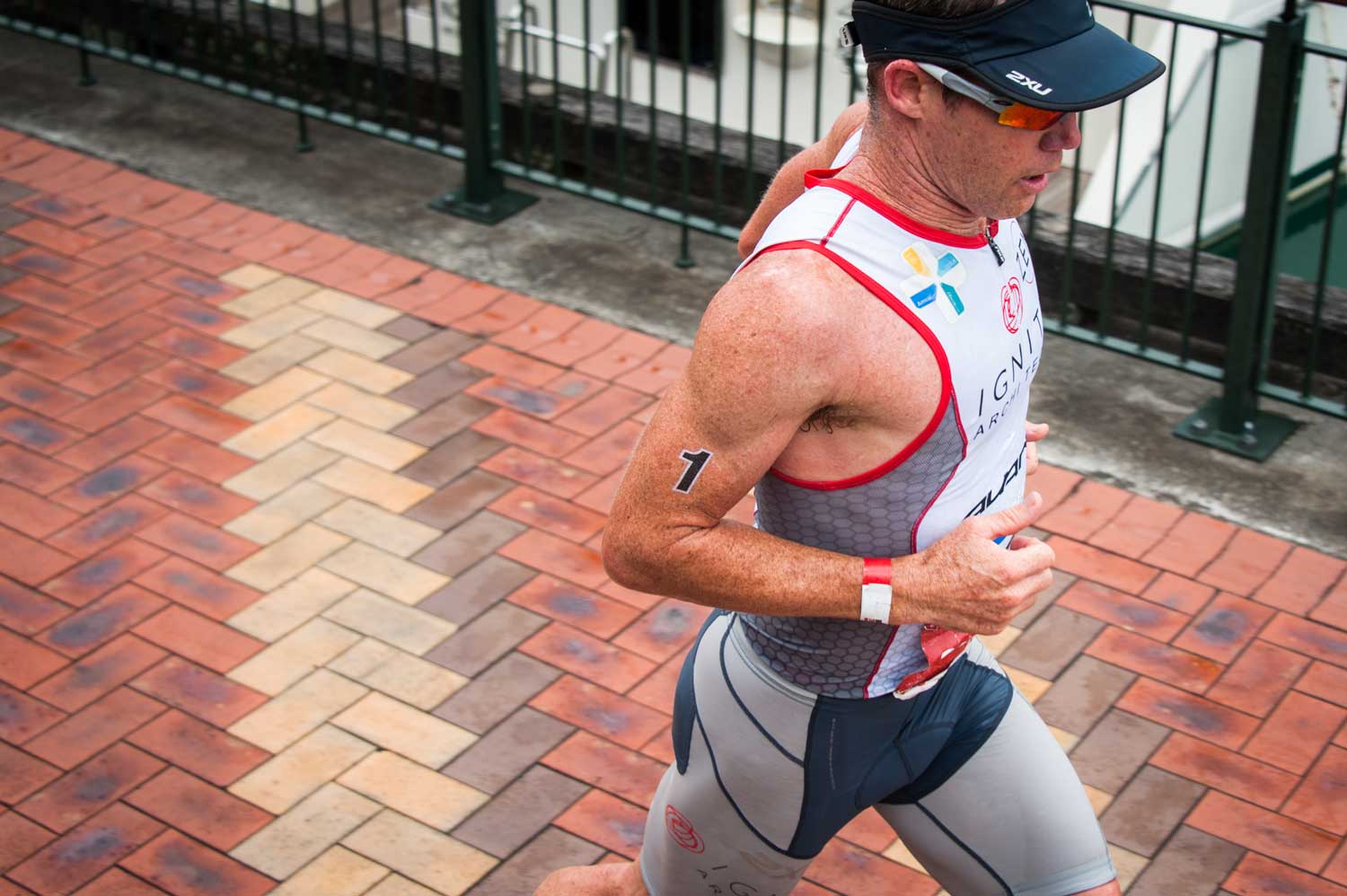 Wearing #1, Cameron Brown pounds the pavement alongside the viaduct.