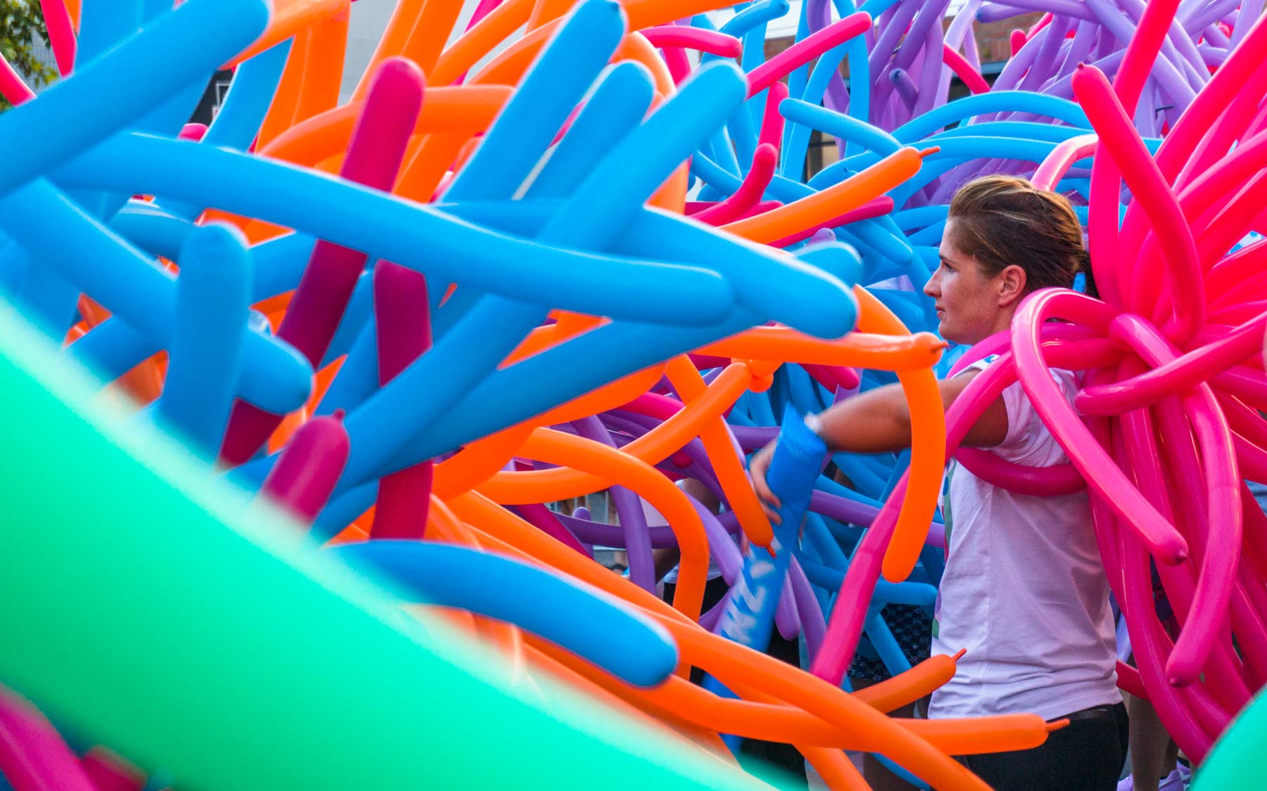 An ANZ member stands amidst the front line of their Pride float.