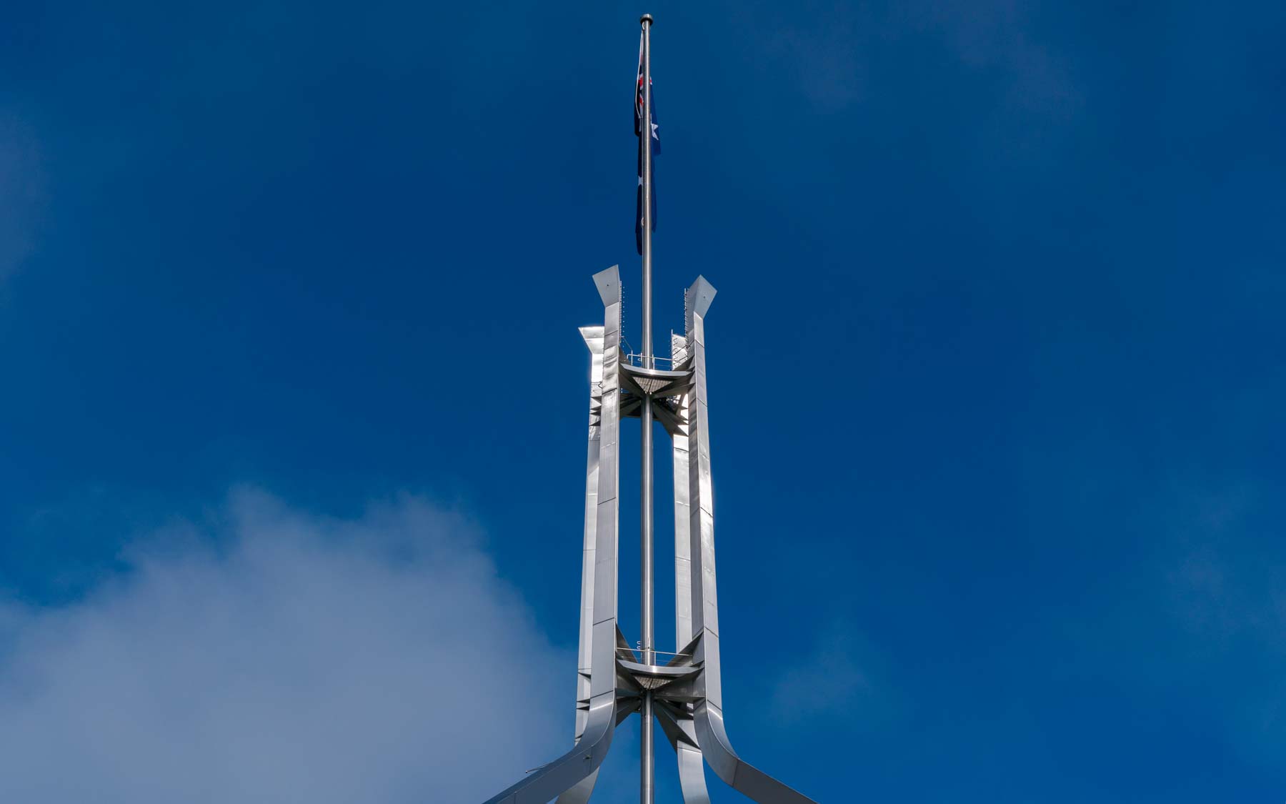 The flag pole on parliament roof.