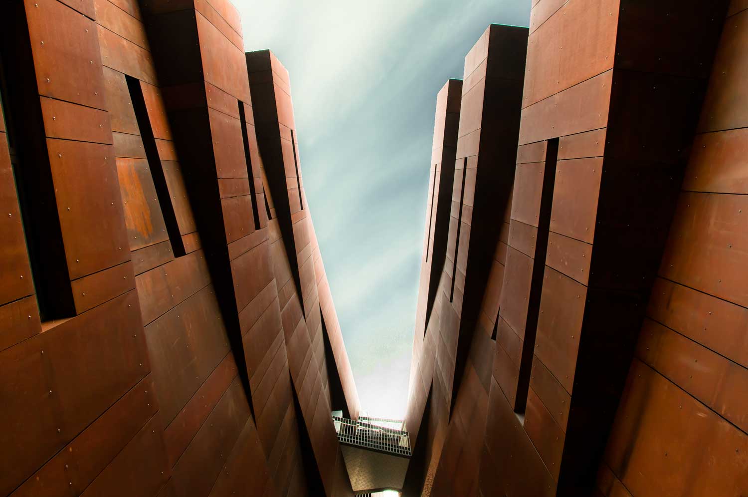 Looking up through the crevice between office towers.