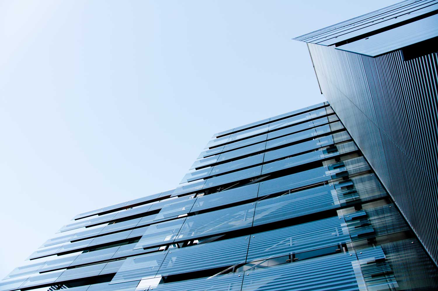 The glass facade of the Owen G Glenn Building.