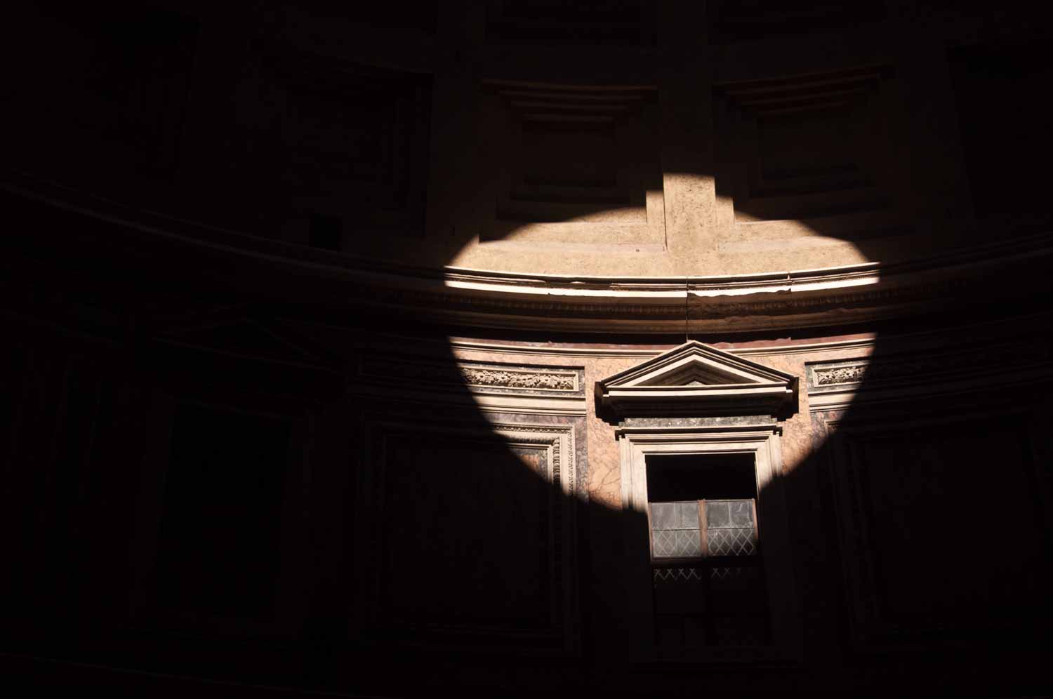 Sunlight streams in through the Oculus, illuminating a point on the interior.